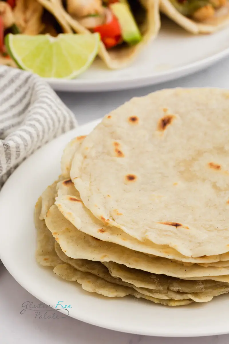 a stack of gluten-free tortillas on a white plate