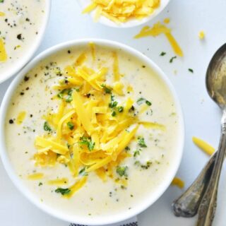 instant pot broccoli cheese soup in a white bowl