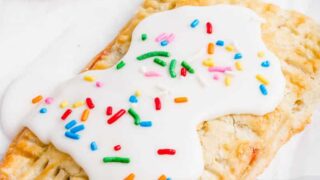 gluten free pop tart topped with a white glaze and sprinkles