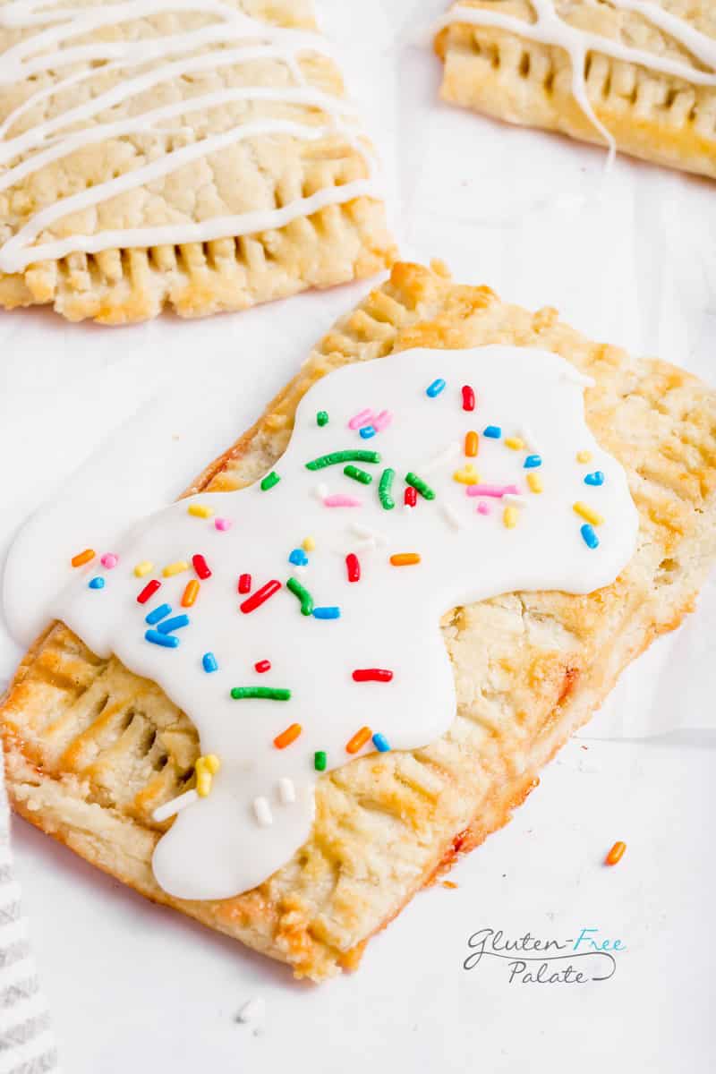 gluten-free pop tart topped with a white glaze and sprinkles