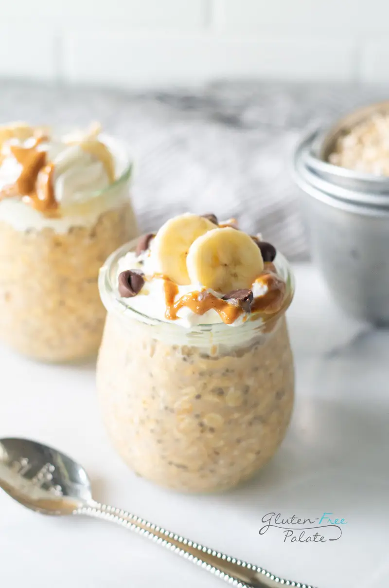 peanut butter overnight oats topped with whipped cream and pb