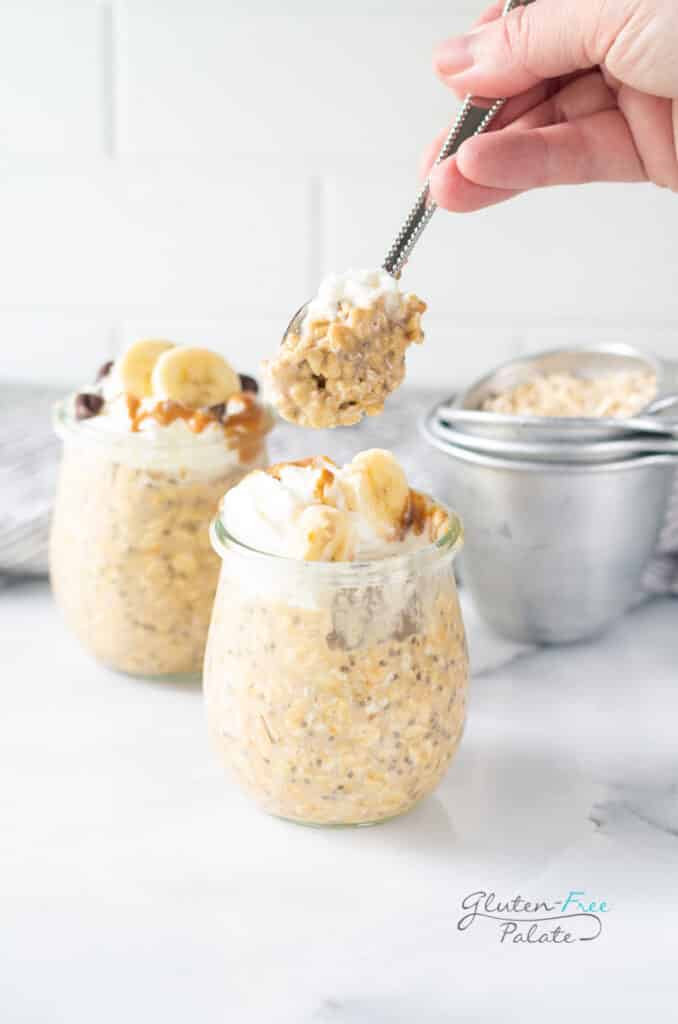 A spoonful of gluten free peanut butter banana overnight oats lifted from the jar