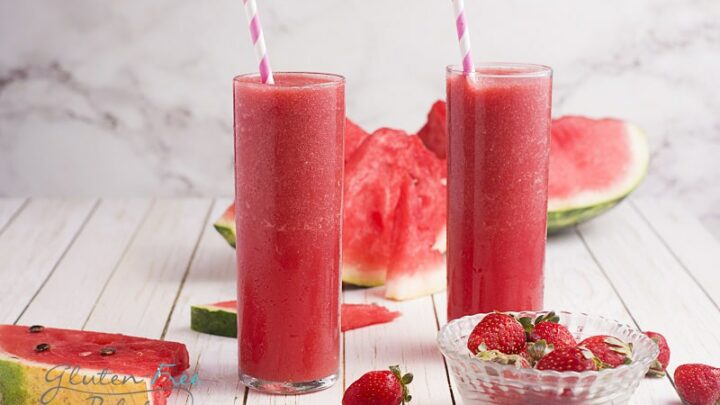two glasses filled with strawberry watermelon smoothie