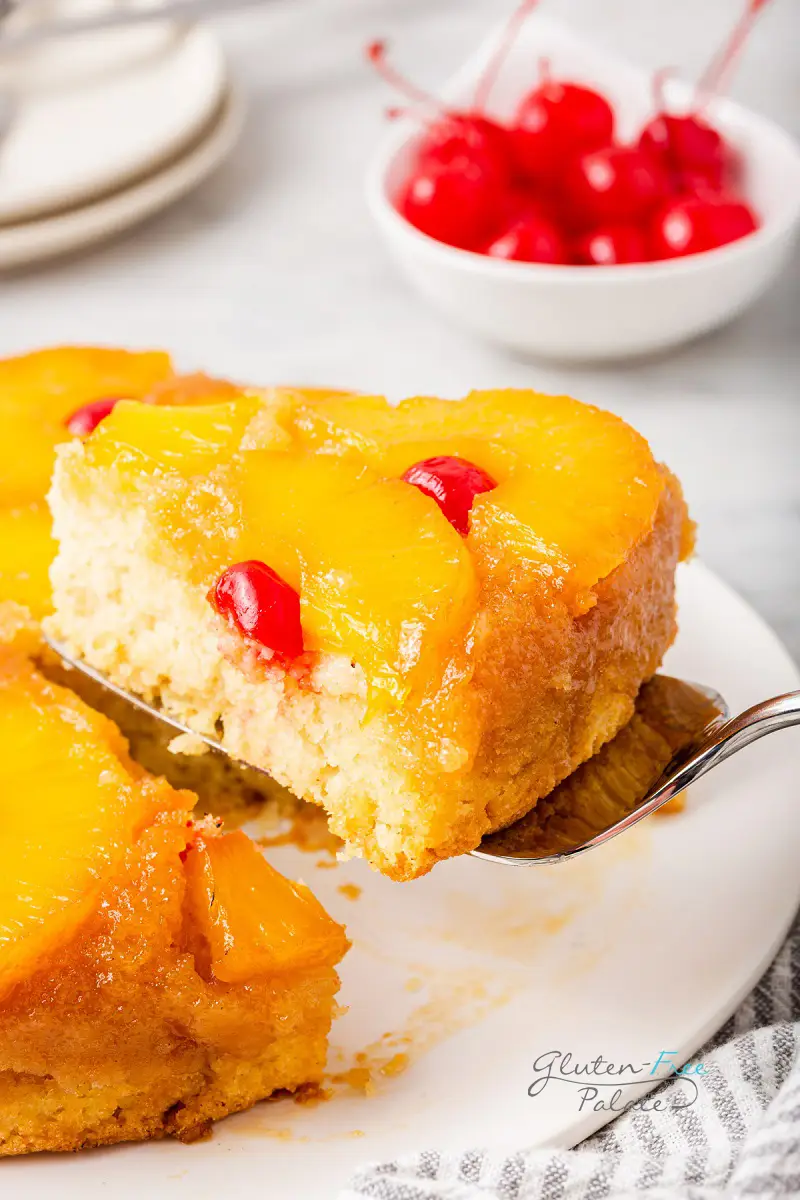 gluten-free pineapple upside down cake being served with a cake server.