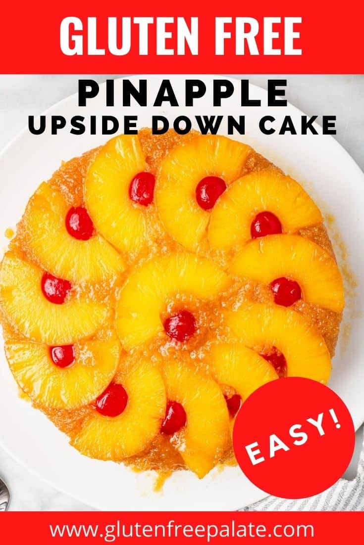 top down view of a round cake topped with pineapple ring halves and cherries.