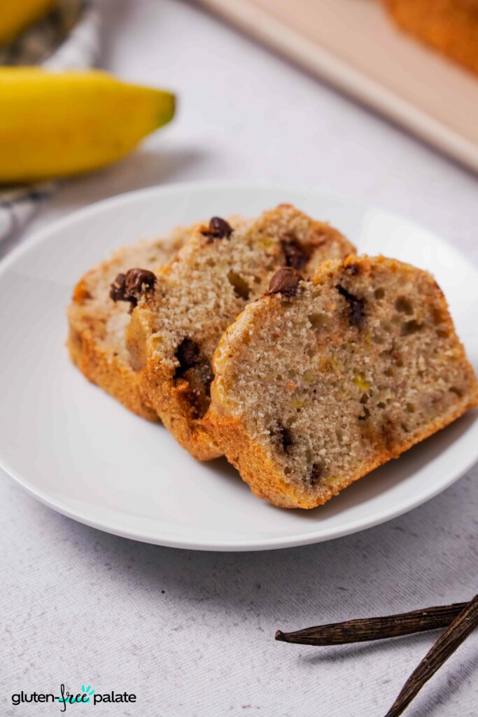 Close up of Gluten-Free Banana Bread sliced on a side plate.