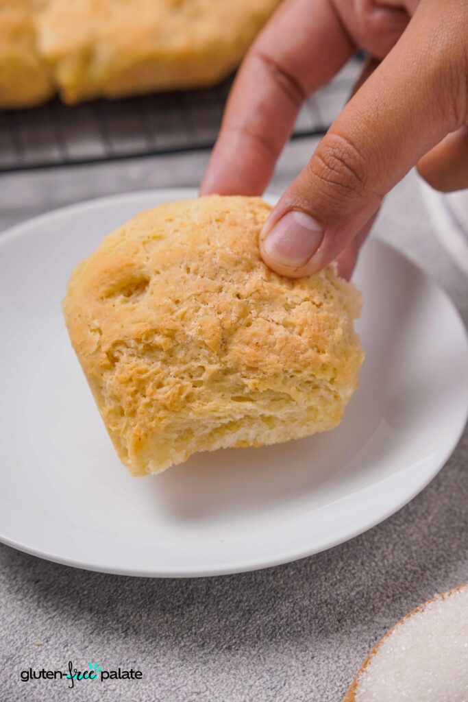 Gluten-Free Rolls being picked up by a hand.