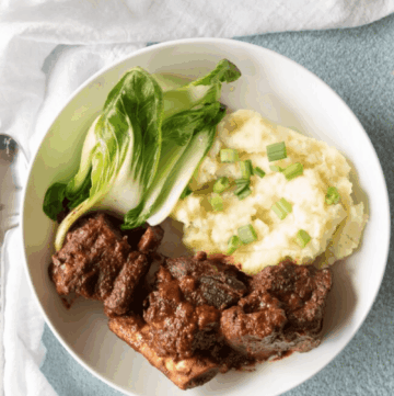 Instant pot short ribs, naturally gluten free, served on a plate.