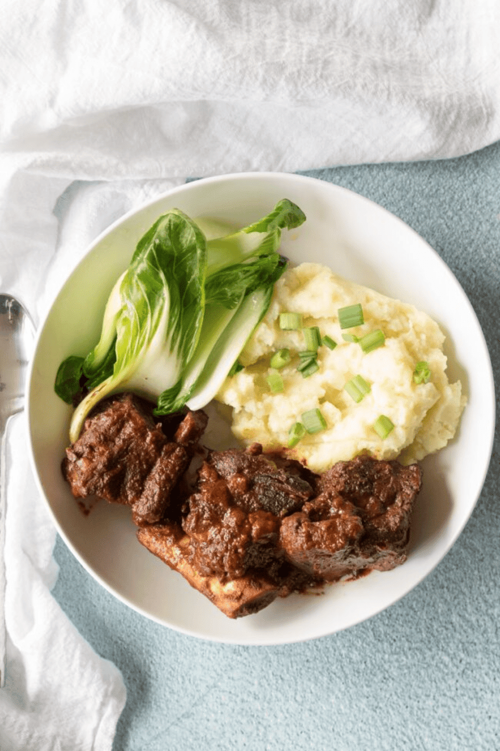 Instant pot short ribs, naturally gluten free, served on a plate.