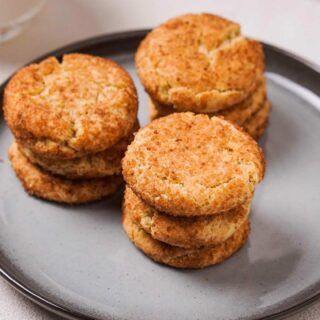 Gluten-Free Snickerdoodles stacked on a plate.