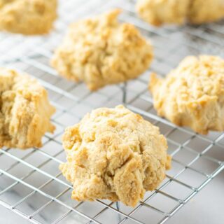 gluten free drop biscuits, cooling on a rectangular wire rack.