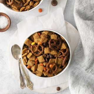 top down view of gluten free chex mix in a white bowl