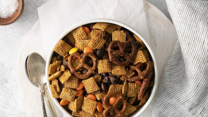 top down view of gluten free chex mix in a white bowl