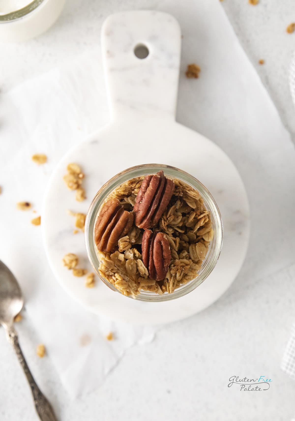 top down view of maple granola in a glass jar