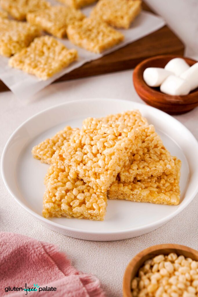 Gluten-free rice krispies treats on a white plate.