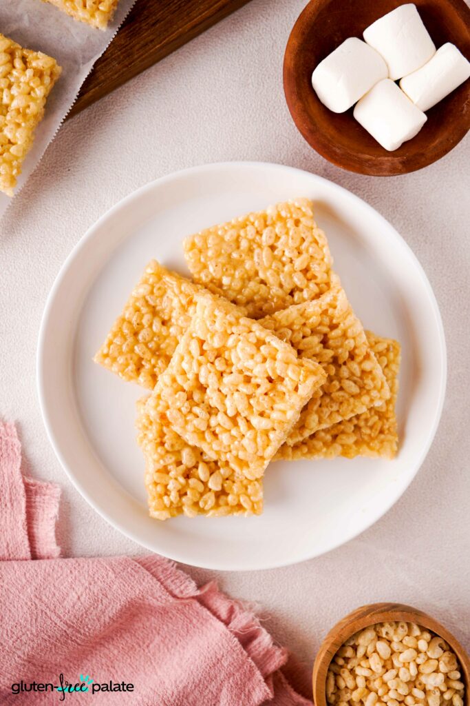 Overhead shot of Gluten-free rice krispies treats on a white plate.