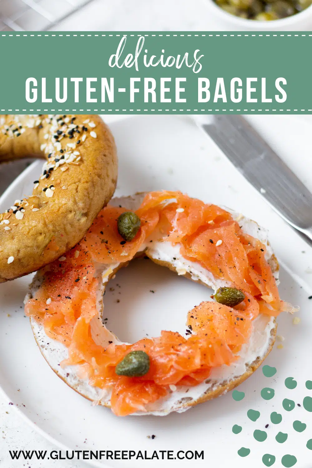 a homemade gluten free bagel topped with cream cheese, lox, and capers on a white plate. Text overlay on image says "delicious gluten-free bagels"