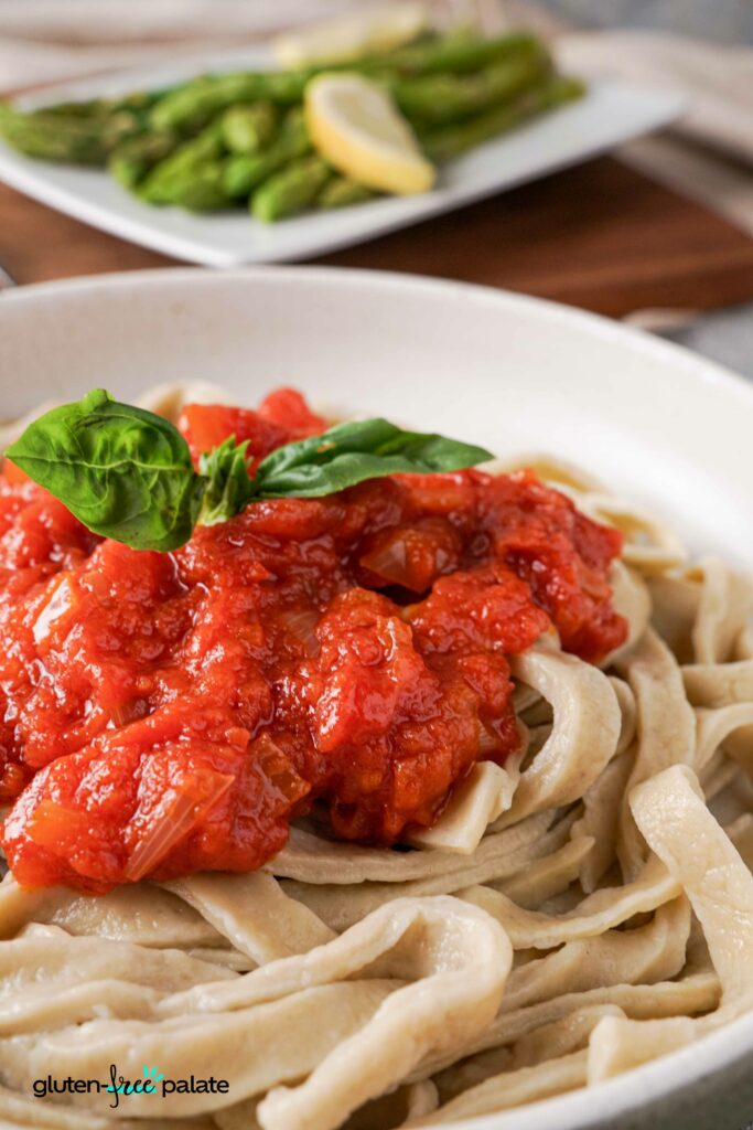 Close up view of Gluten-free pasta in a bowl with pasta sauce.