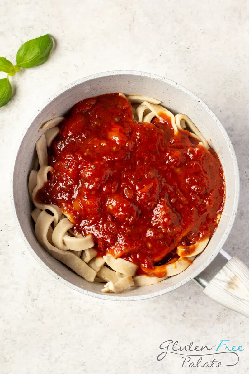 Gluten-free pasta recipe in a pot with sauce