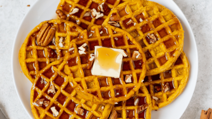 Gluten-Free Pumpkin Waffles on a white serving plate.