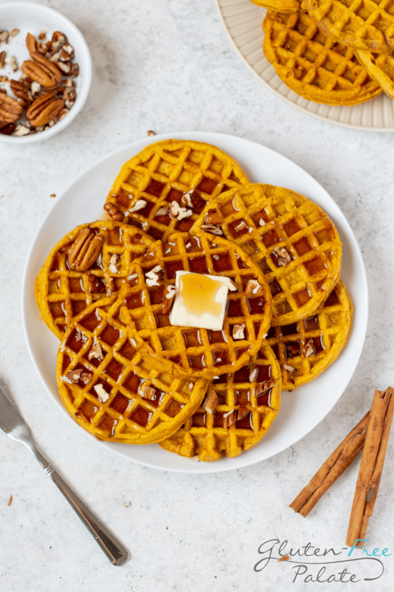 Gluten-Free Pumpkin Waffles on a white serving plate.