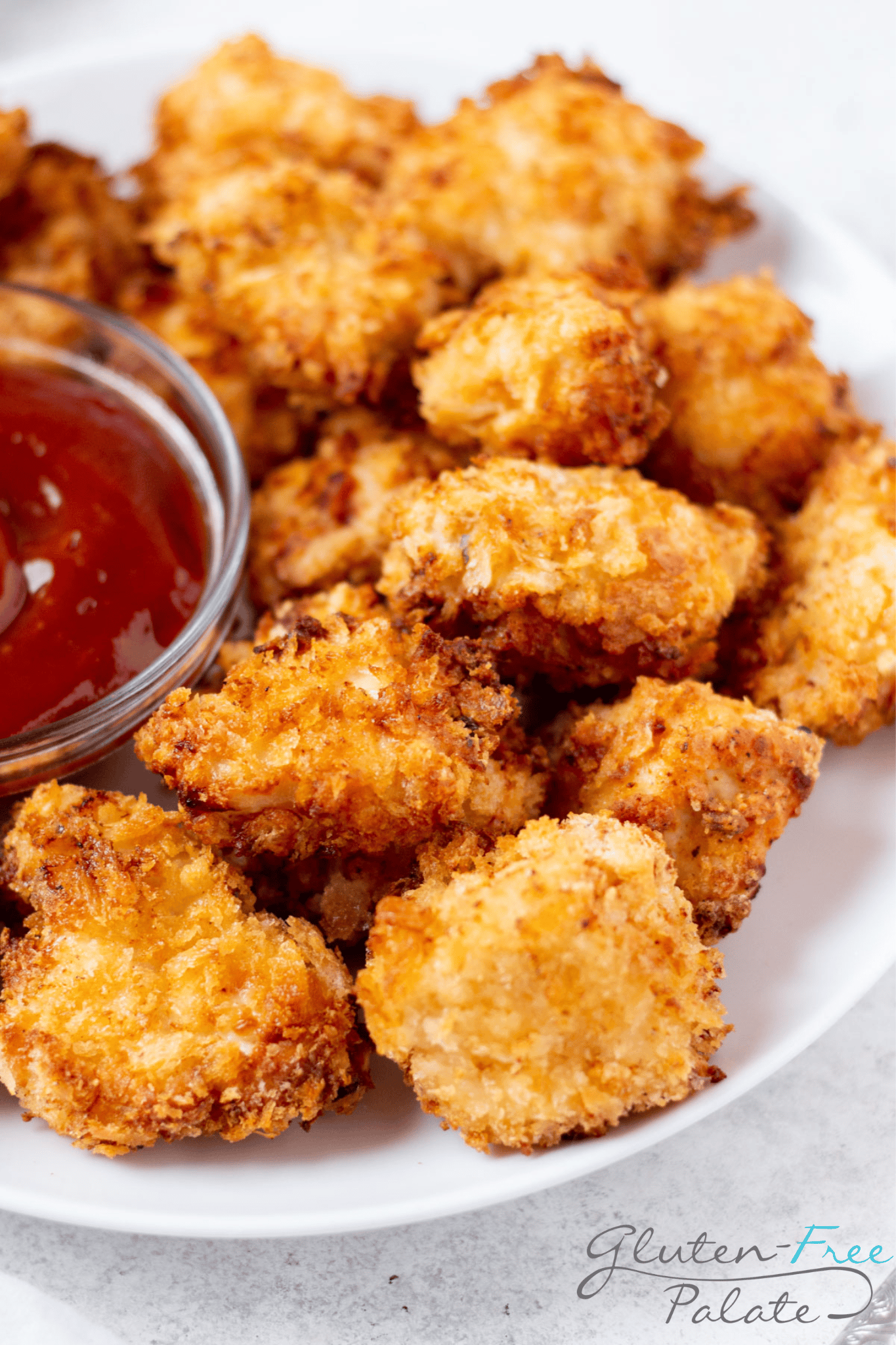closeup view of a plate of baked gluten-free chicken nuggets