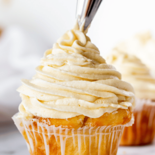 Gluten-Free Buttercream Frosting being frosted onto a cupcake.