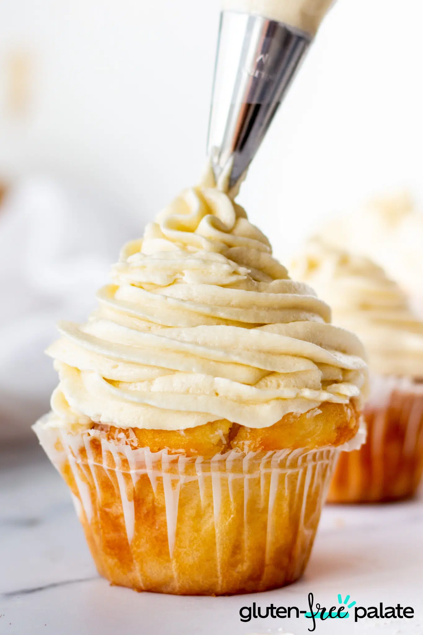 Gluten-Free Buttercream Frosting being frosted onto a cupcake.
