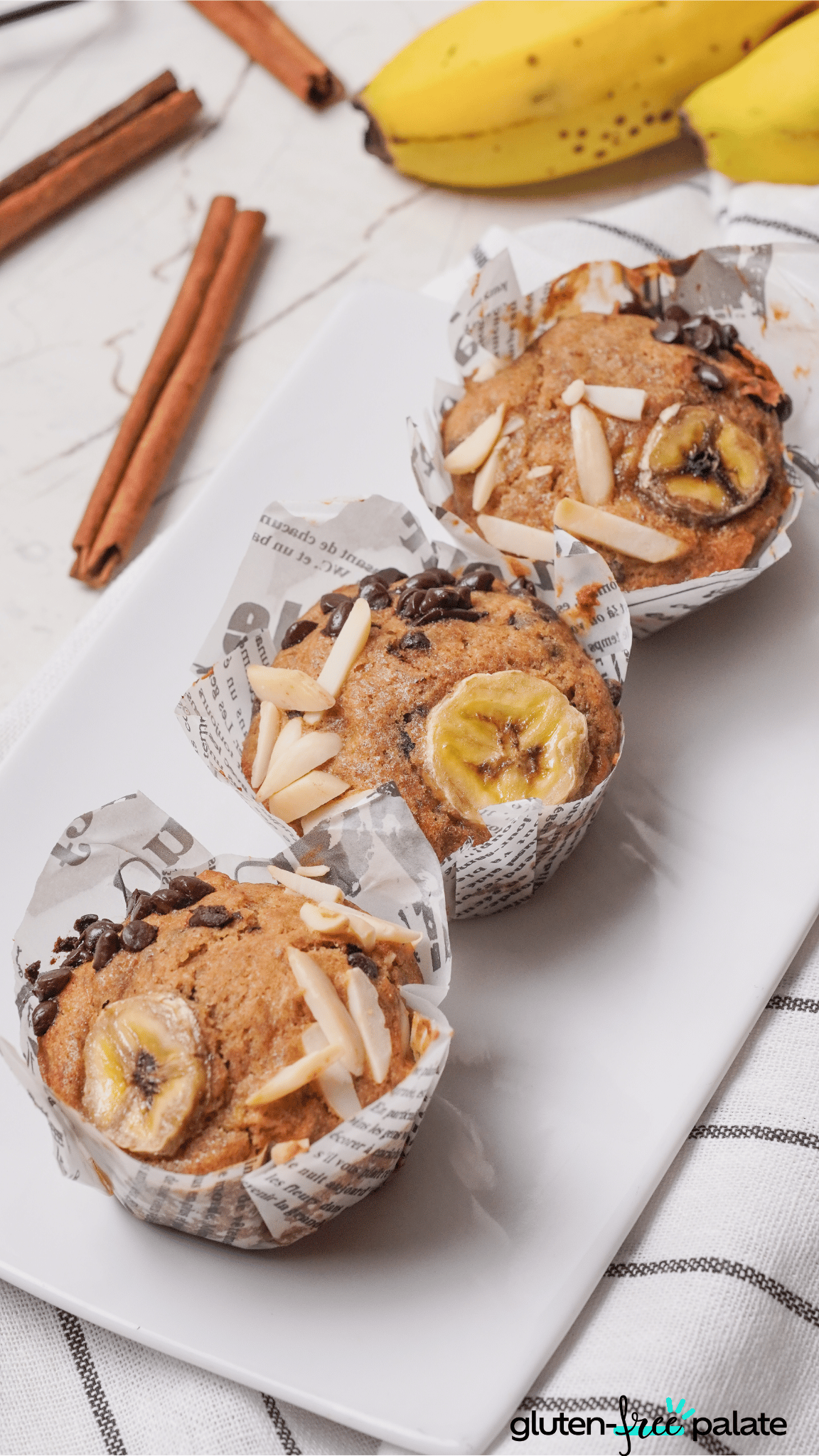 three gluten-free banana muffins on a white plate