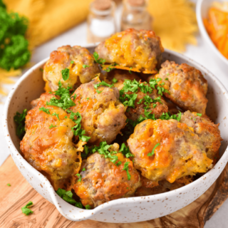 Gluten-free sausage balls in a white bowl. Photo by Gluten-Free Palate.