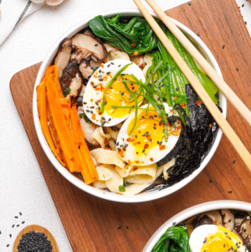 gluten-free ramen in two white bowls with chopsticks