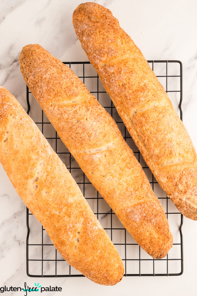 Gluten free baguettes on a colling rack.