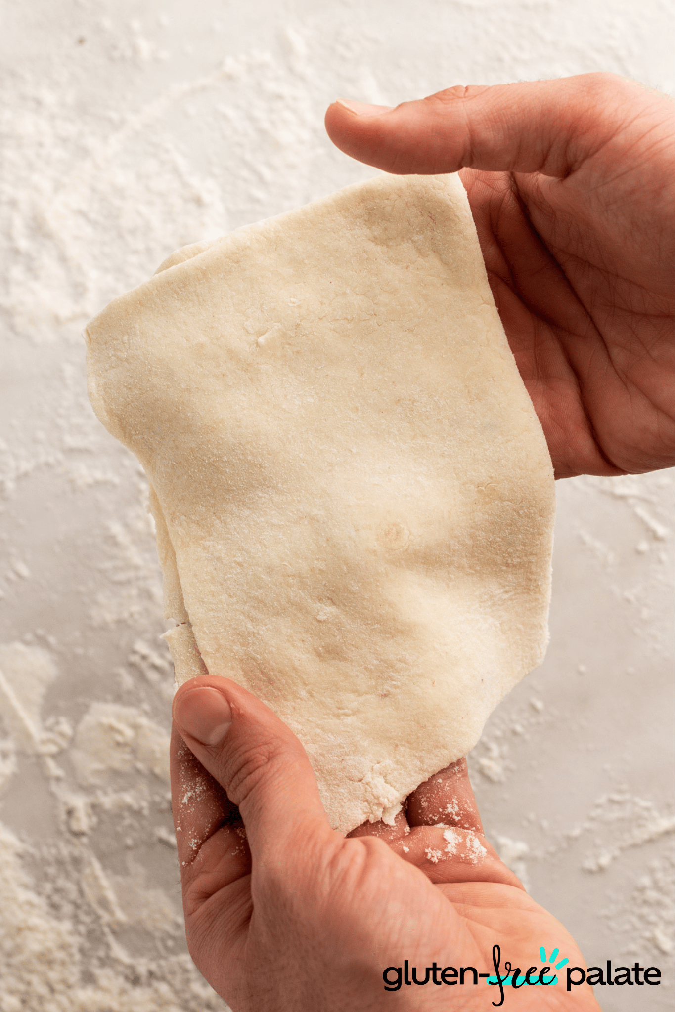 Gluten-Free Phyllo Dough being held in both hands