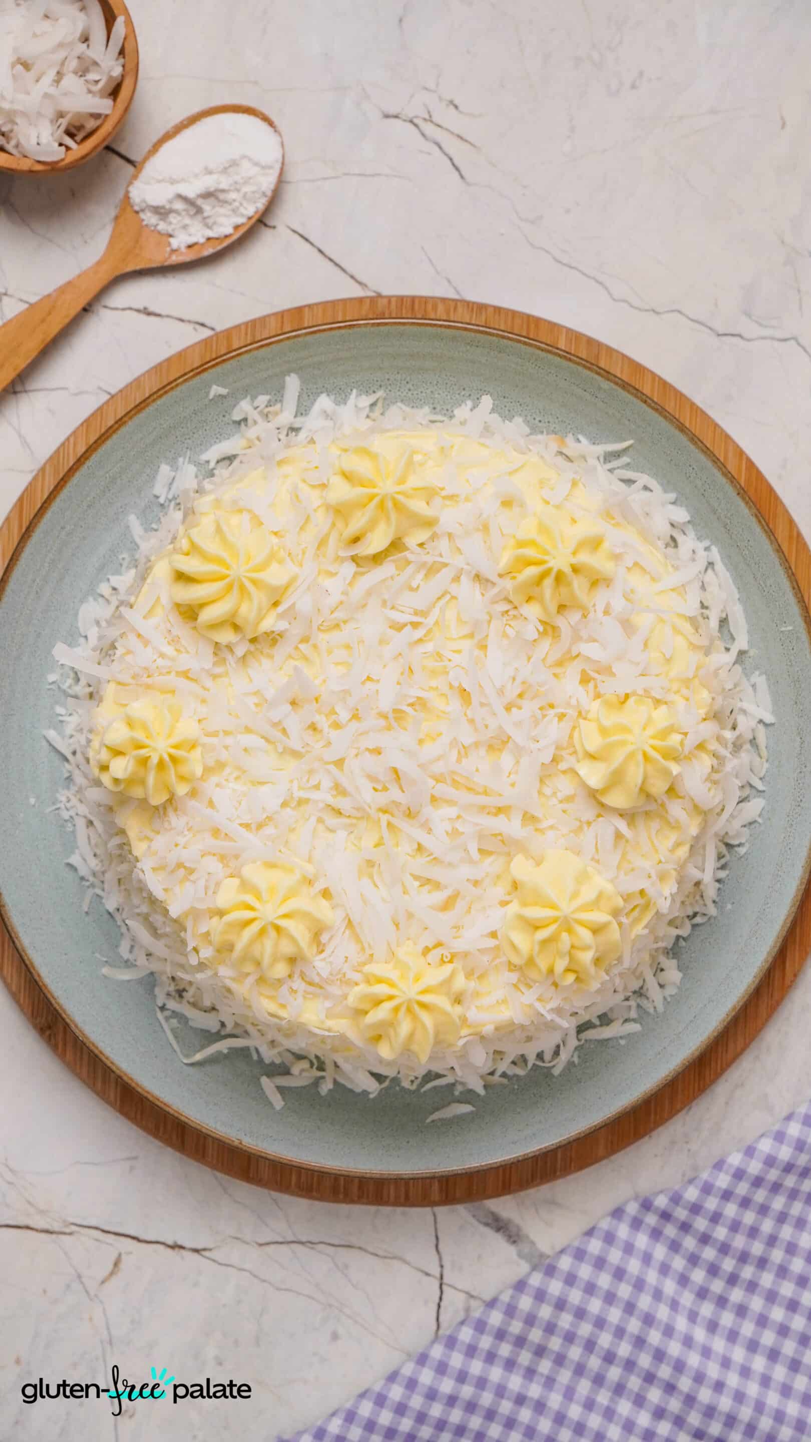 gluten-free coconut cake on a cake plate
