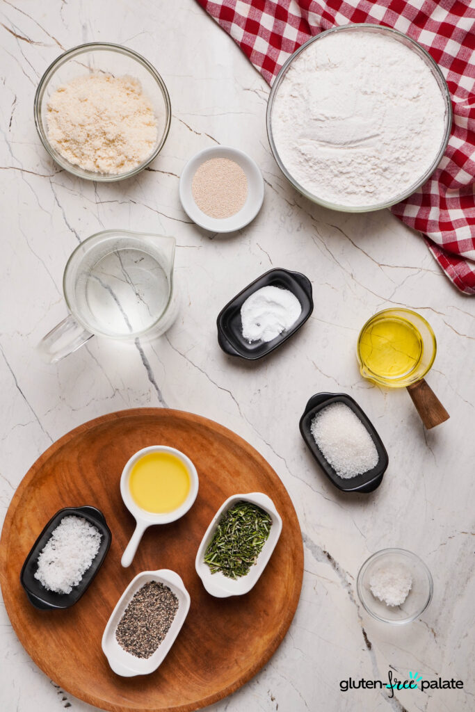 Ingredients for gluten-free focaccia including flour, yeast, and olive oil.