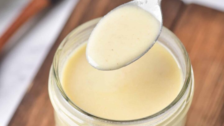gluten-free roux in a jar and a silver spoon showing the consistency