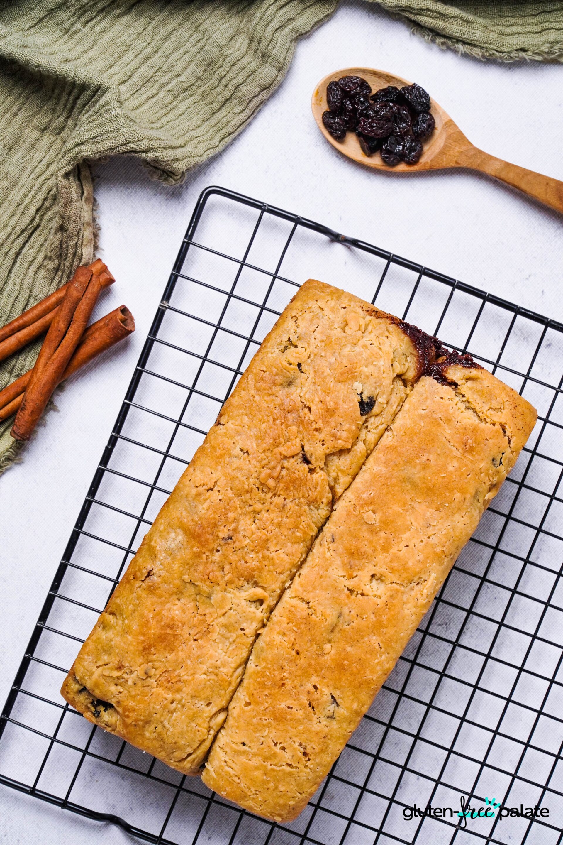 Gluten-free cinnamon raisin bread on a cooling rack.