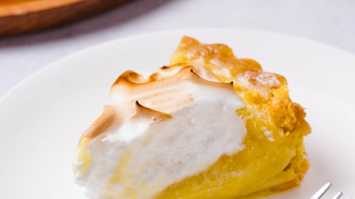 Gluten-free lemon meringue slices on a white plate.