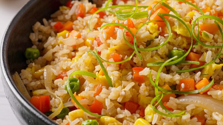Gluten-free fried rice in a black bowl.