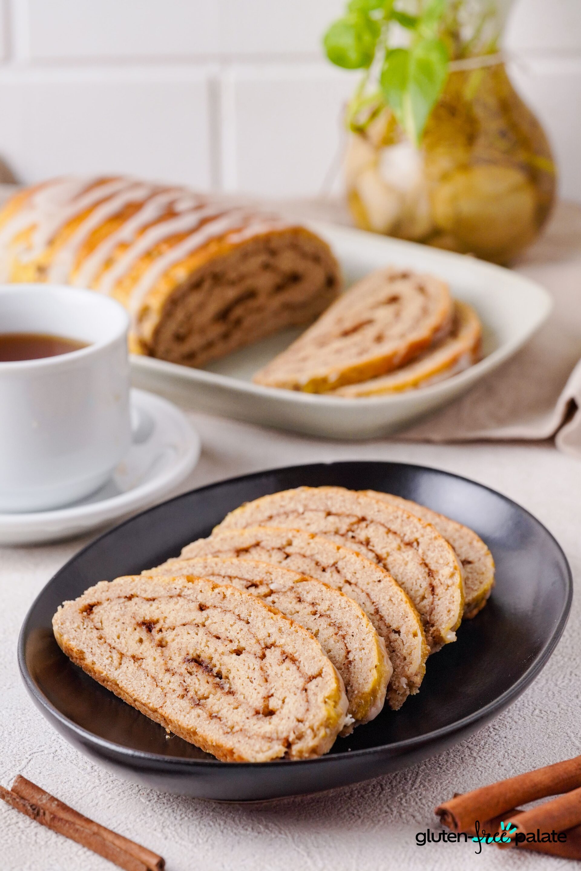 Gluten-Free cinnamon bread sliced on a black plate.