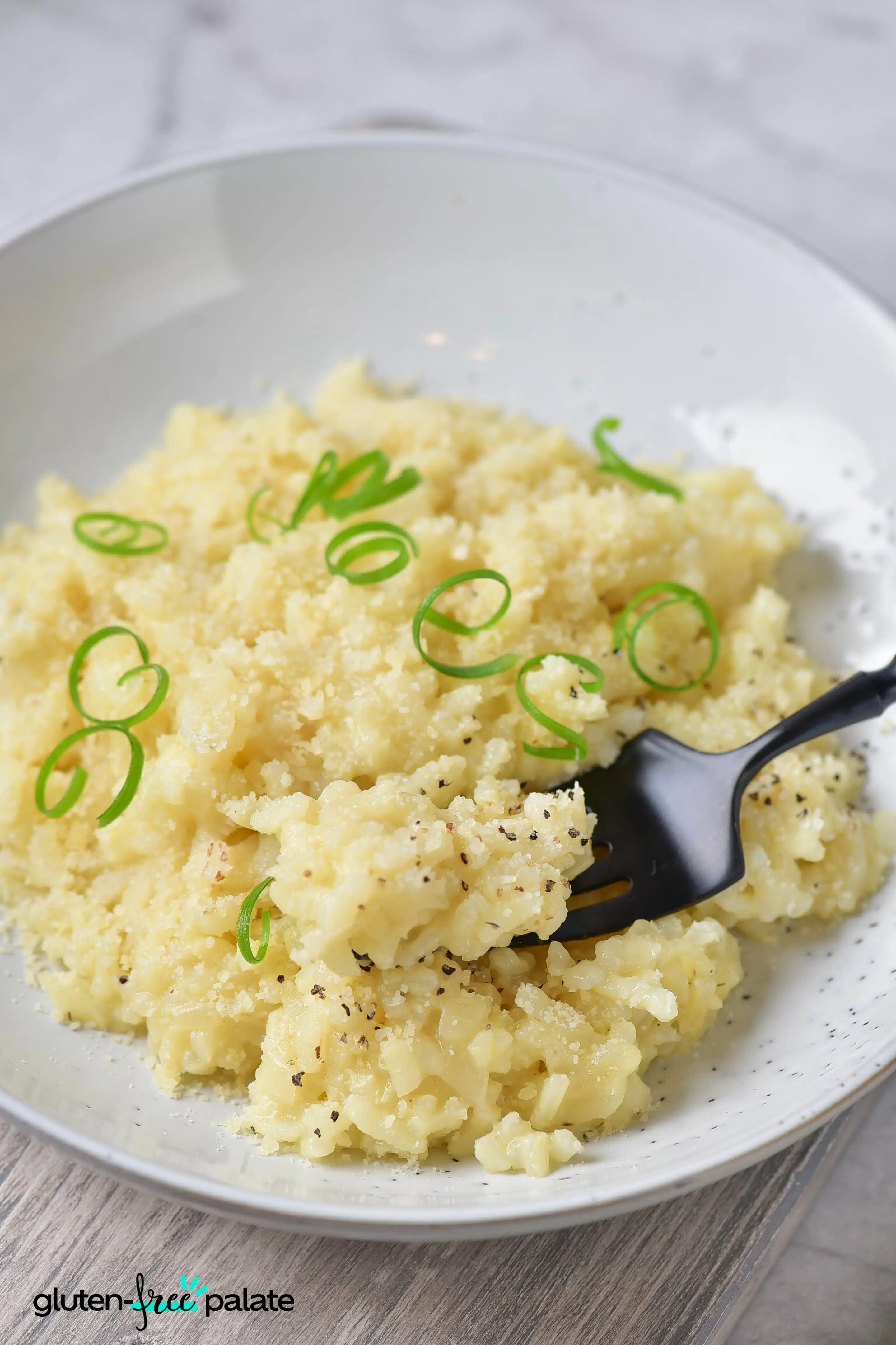 Gluten-Free Risotto in a white plate with garnishing.