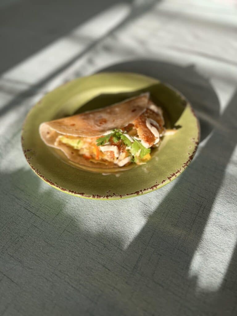Gluten-Free Fish Tacos on a green plate.