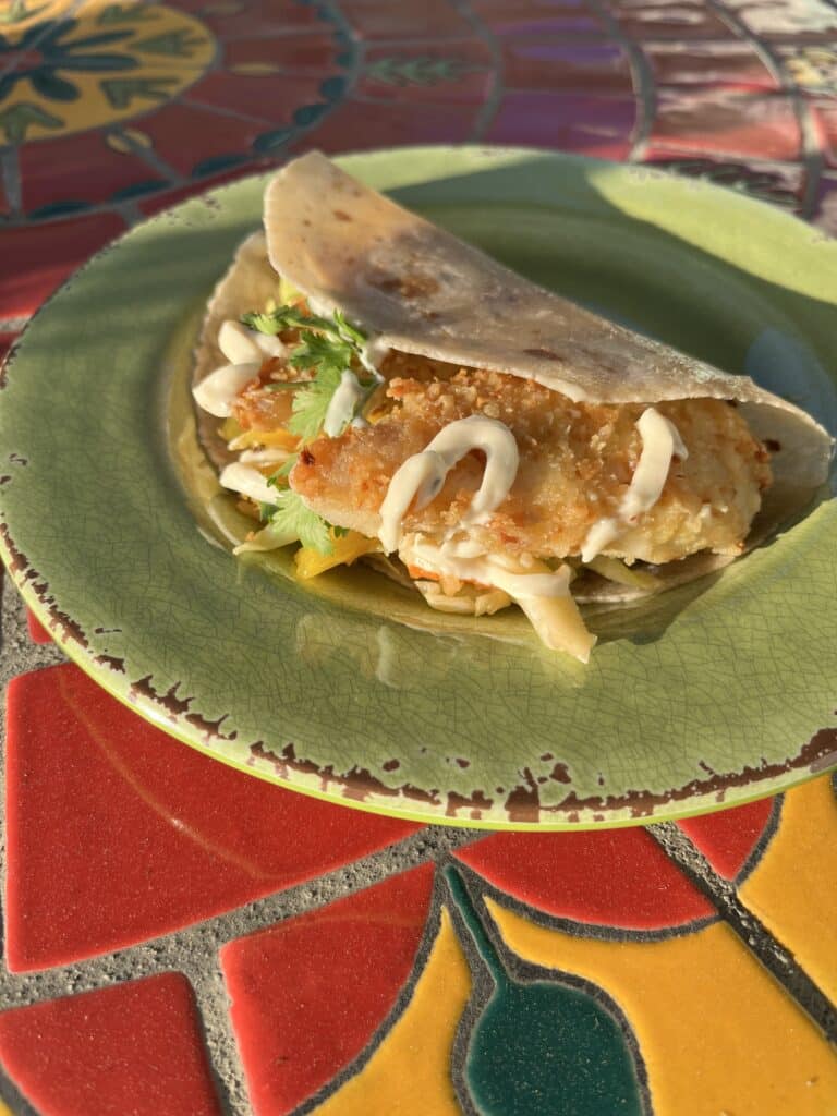 Gluten-Free Fish Tacos on a green plate.
