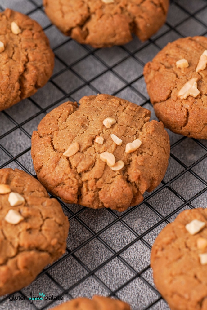 Gluten-free peanut butter cookies on a cooling rack.