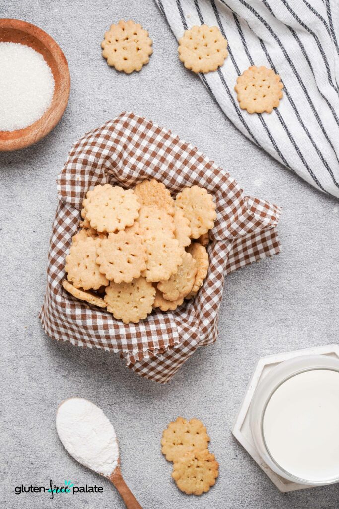 Gluten-free ritz crackers in a basket with a cloth.