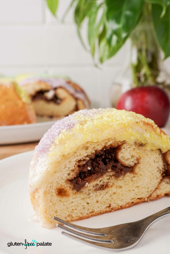 Gluten-Free King Cake slice side view with colored sugar.