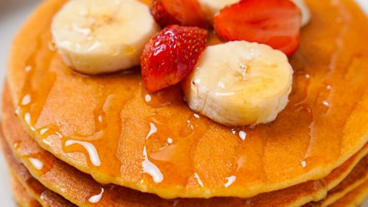 Top down view of Gluten-Free Protein pancakes on a white plate.