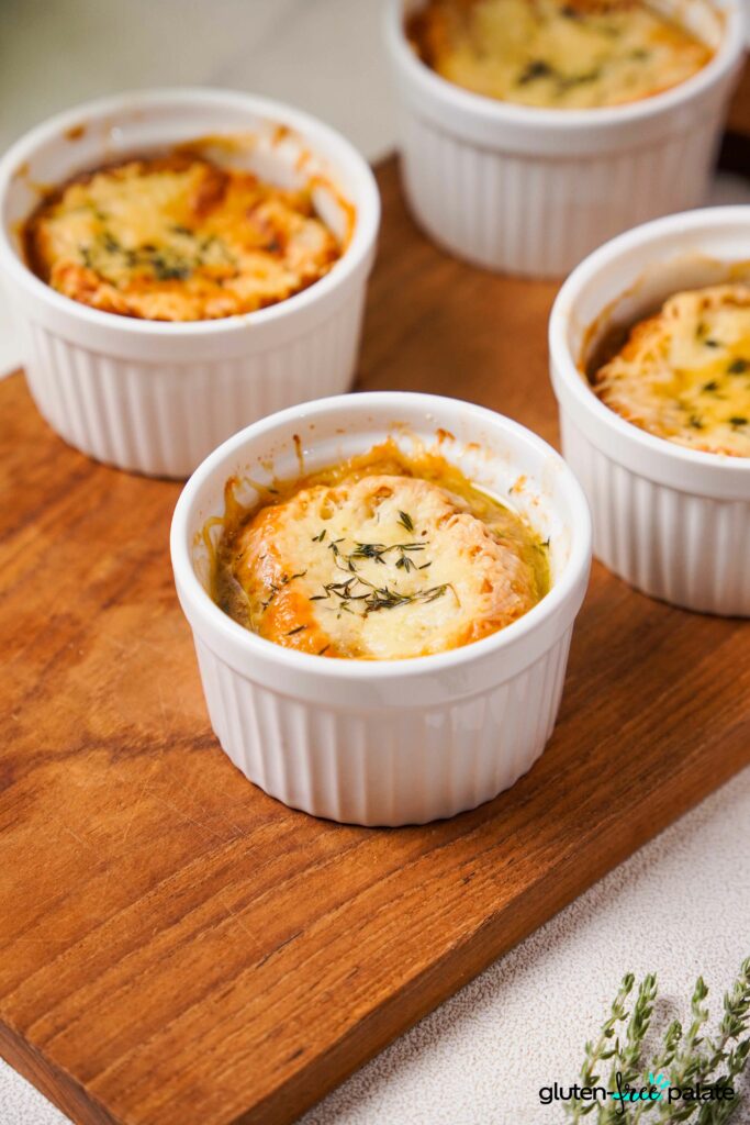 Gluten-Free French onion soups in a white ramekins.