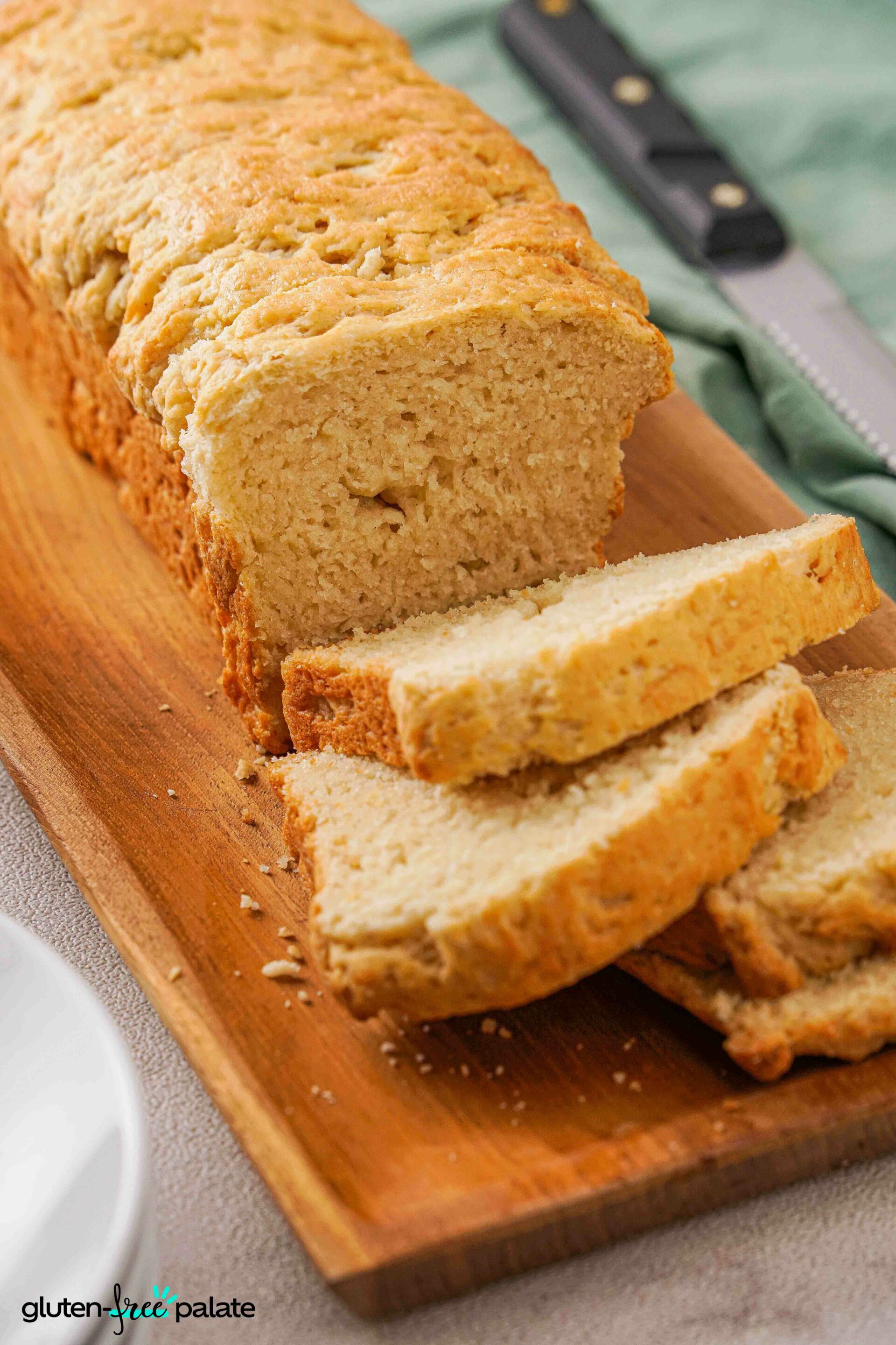 Close up view of slices of Gluten-Free Brioche on a bread board.