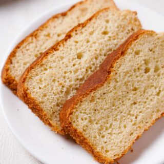 Three slices of gluten-free potato bread on a white plate.